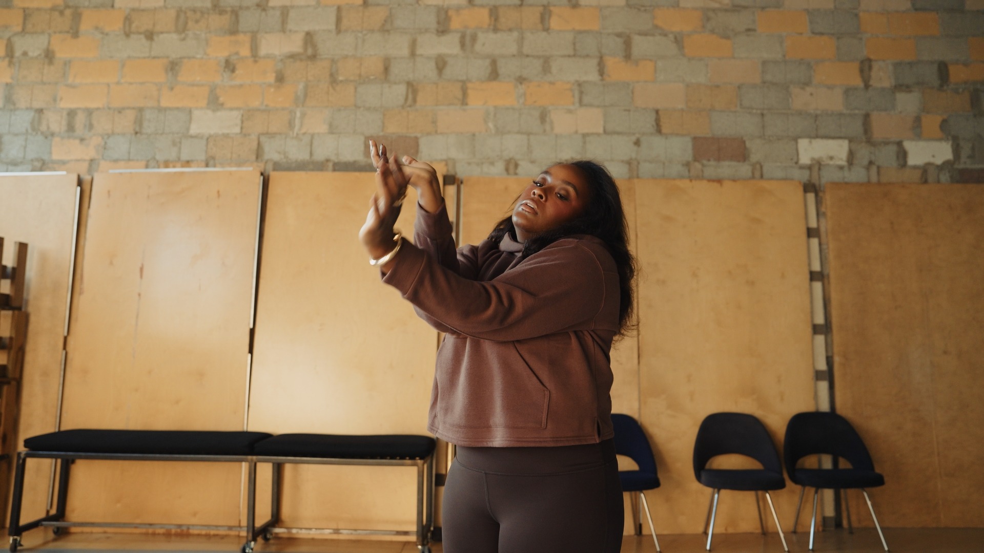 Lyrric sharing her story inside a studio